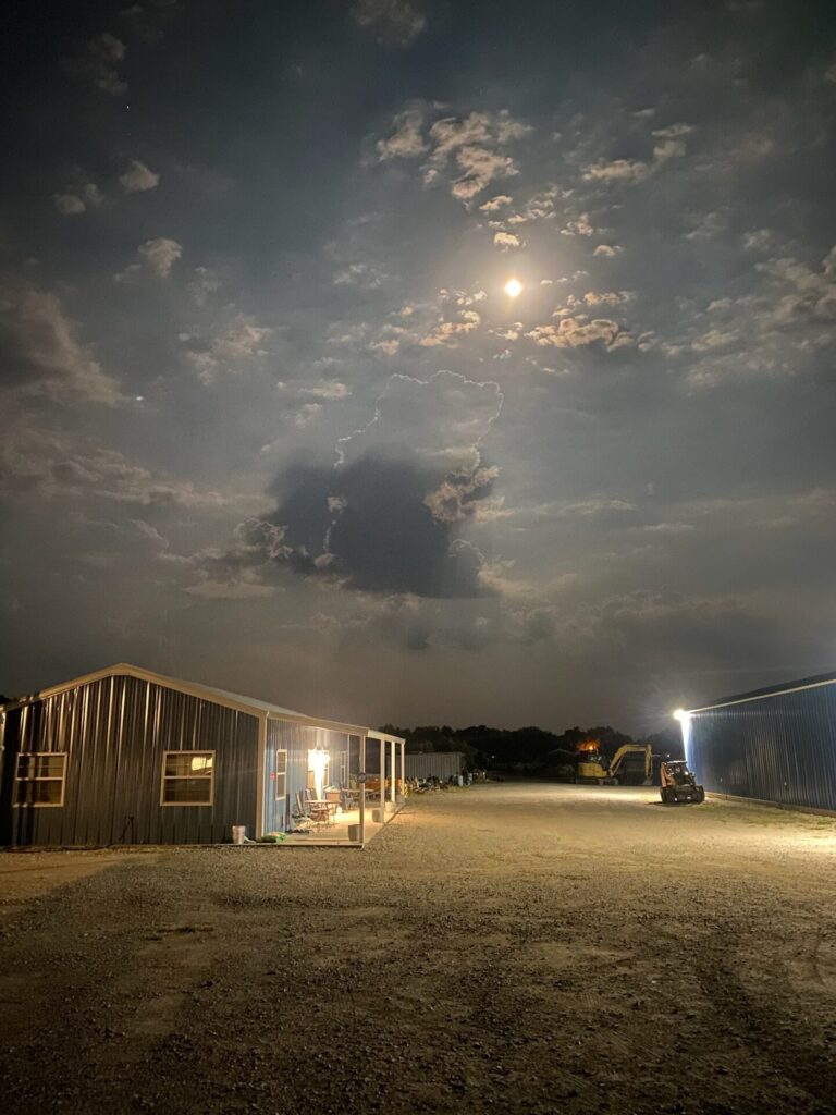 moonlight cloudy night over a construction yard